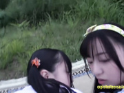 Japanese teen Azuki and her girlfriend are enjoying ffm threesome outdoors